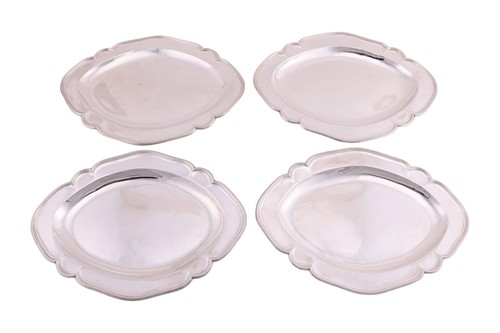 Lot 277 - A set of four George III Scottish silver meat...