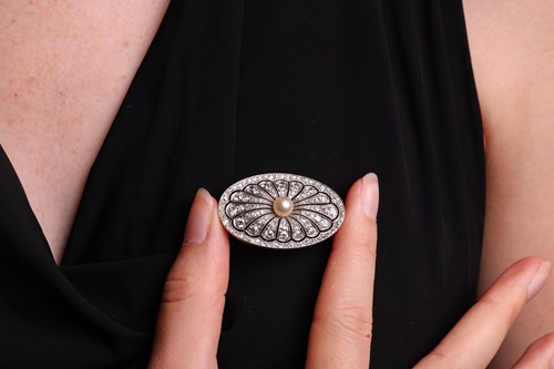 Lot 41 - A pearl and diamond-set plaque brooch,...
