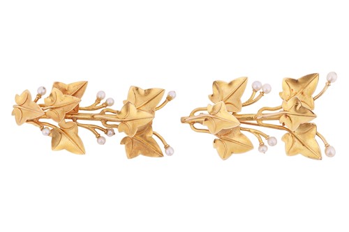 Lot 65 - A near pair of leaf brooches, each depicting...