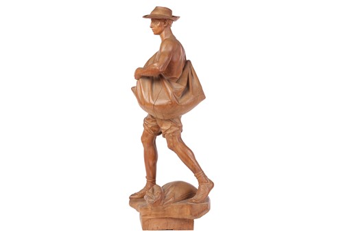 Lot 65 - A large carved fruit wood figure, 'The Sower',...