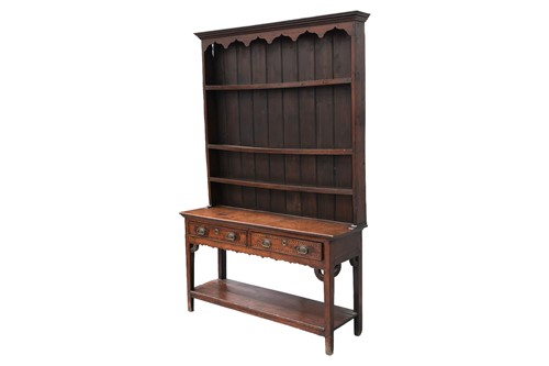 Lot 47 - An early 19th-century oak dresser, the rack...