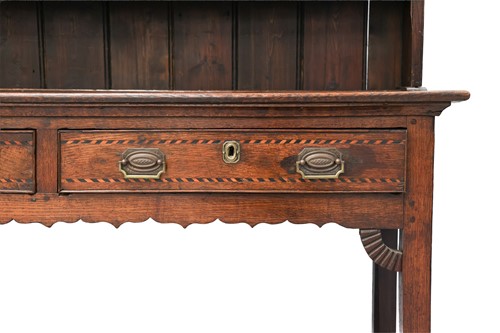 Lot 47 - An early 19th-century oak dresser, the rack...