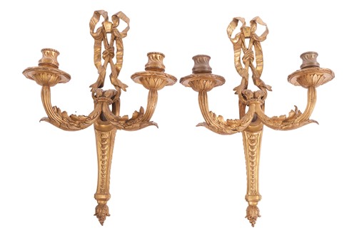 Lot 85 - A pair of ormolu twin wall lights, with scale...