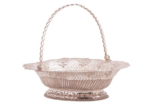 Lot 265 - A George III silver cake basket, the oval...