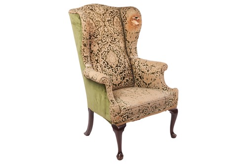 Lot 57 - A George II mahogany wing armchair with...