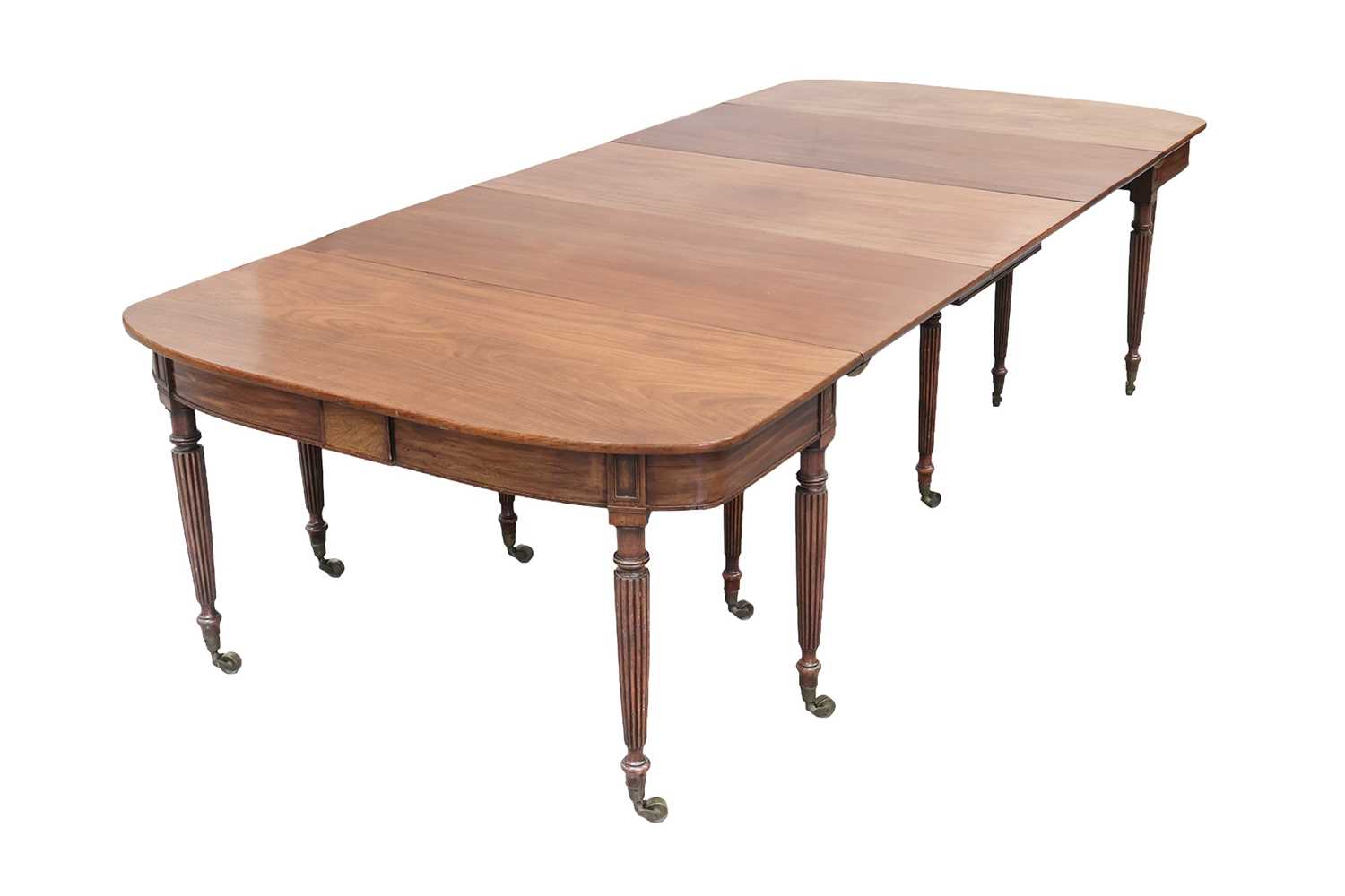 Lot 20 - A Regency mahogany extending dining table, in...