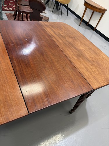 Lot 20 - A Regency mahogany extending dining table, in...