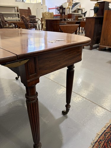 Lot 20 - A Regency mahogany extending dining table, in...