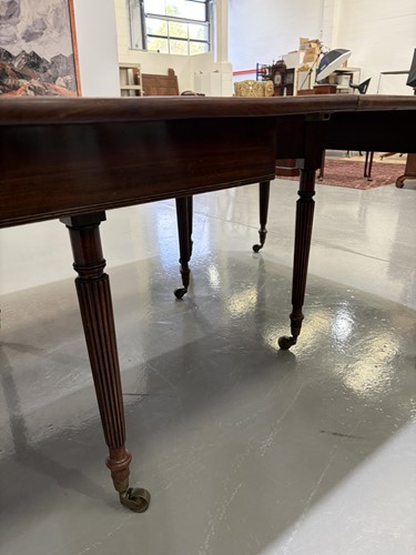 Lot 20 - A Regency mahogany extending dining table, in...