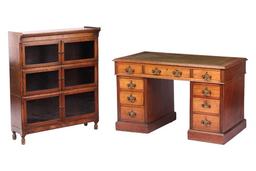 Lot 25 - An Edwardian walnut pedestal desk, with green...
