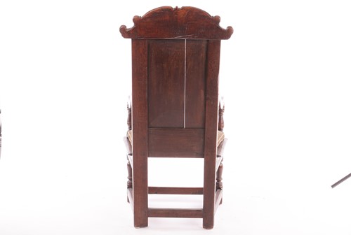 Lot 41 - An 18th-century oak wainscot chair, with a...