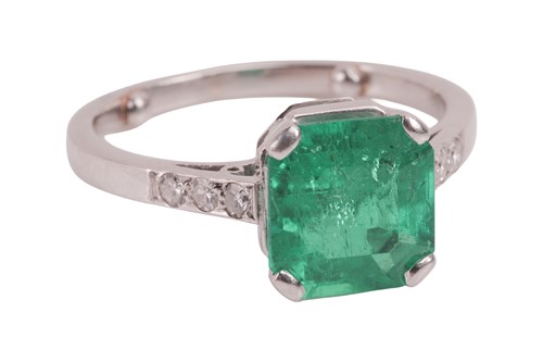 Lot 57 - A Colombian emerald dress ring, claw-set with...