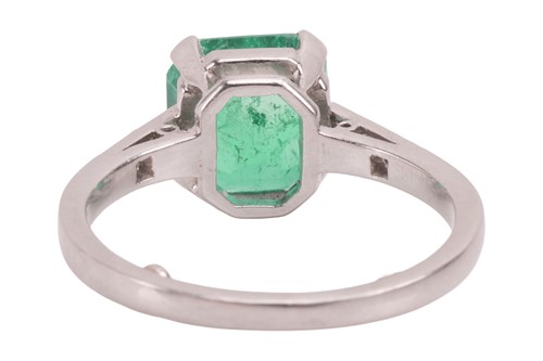 Lot 57 - A Colombian emerald dress ring, claw-set with...