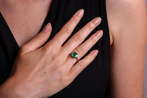 Lot 57 - A Colombian emerald dress ring, claw-set with...