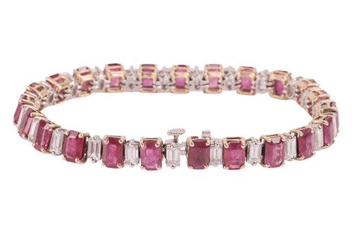 Lot 111 - A ruby and diamond line bracelet, set with...