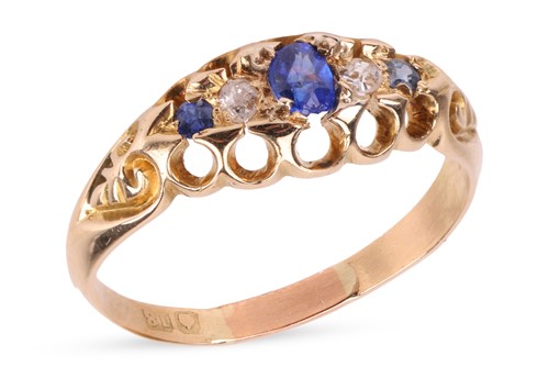 Lot 34 - A sapphire and diamond half-hoop ring in 18ct...