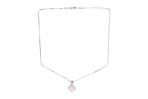 Lot 130 - A pearl and diamond pendant and chain, the...