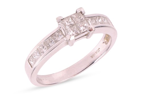Lot 132 - An illusion-set diamond ring, set with four...