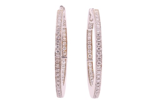 Lot 154 - A pair of diamond hoop earrings, set to the...