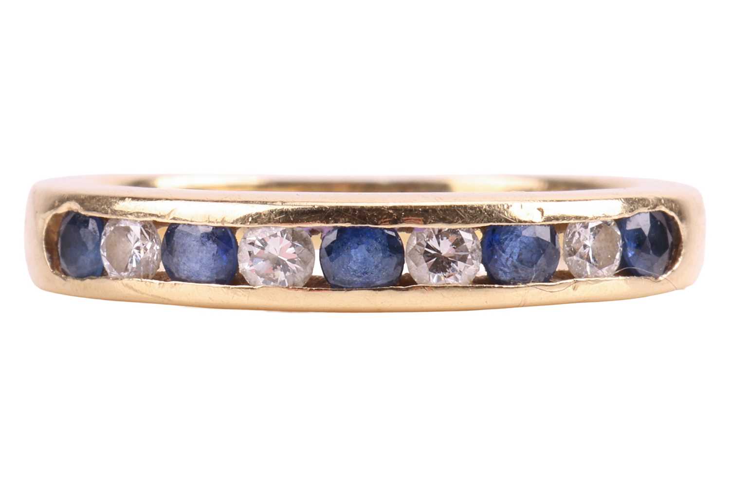 Lot 138 - A sapphire and diamond half eternity ring,...