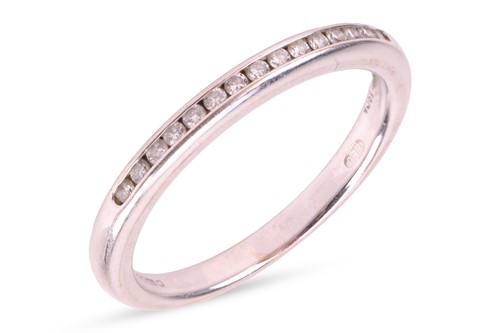 Lot 155 - A diamond half eternity ring, set with round...