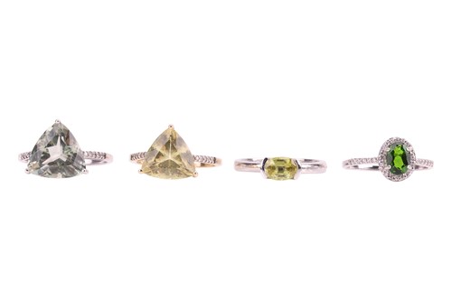 Lot 59 - Four green gem-set rings; to include, a chrome...