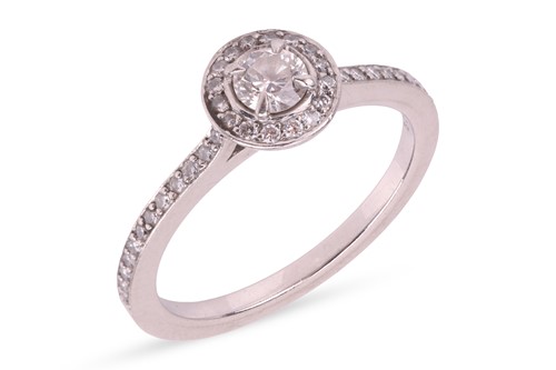 Lot 185 - Boodles - a diamond halo ring, claw-set with a...