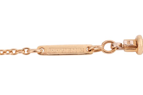 Lot 179 - Cartier - An 18ct gold diamond-set cross...