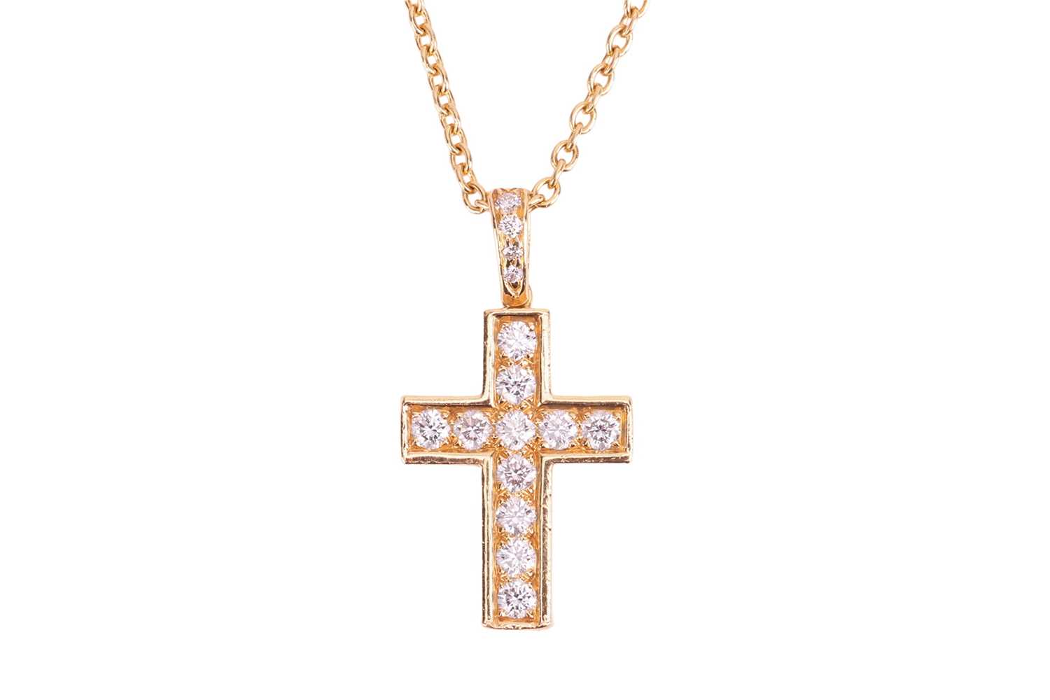 Lot 179 - Cartier - An 18ct gold diamond-set cross...