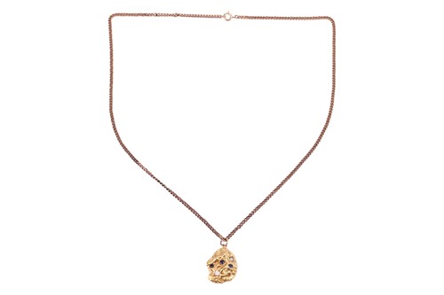 Lot 72 - A sapphire and diamond-set nugget pendant, of...