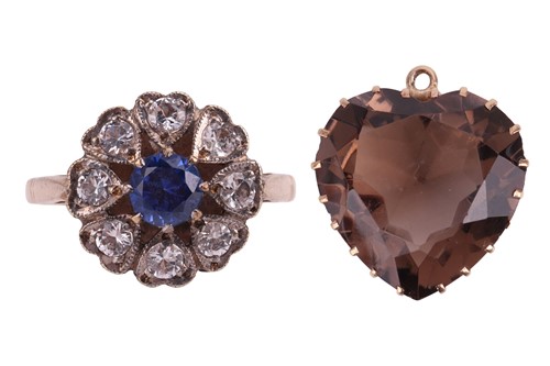 Lot 9 - A synthetic blue sapphire and white topaz...