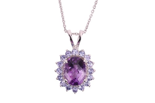 Lot 87 - An amethyst and tanzanite cluster pendant,...