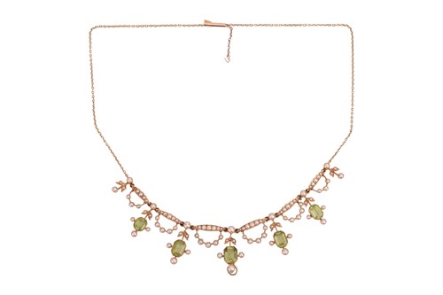 Lot 30 - An Edwardian peridot and seed pearl fringe...