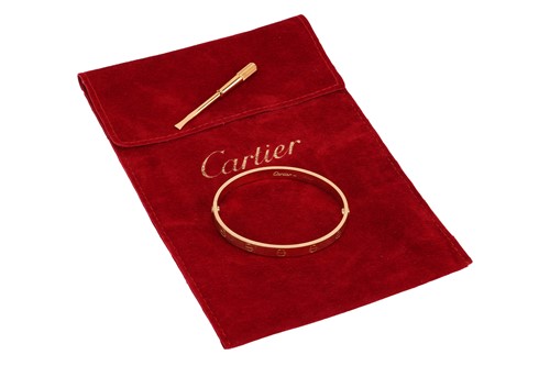 Lot 180 - Cartier - A 'LOVE' bangle, composed of two...