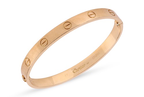 Lot 180 - Cartier - A 'LOVE' bangle, composed of two...