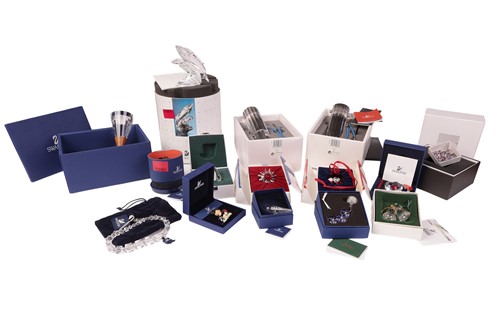 Lot 164 - A collection of boxed Swarovski crystal items,...