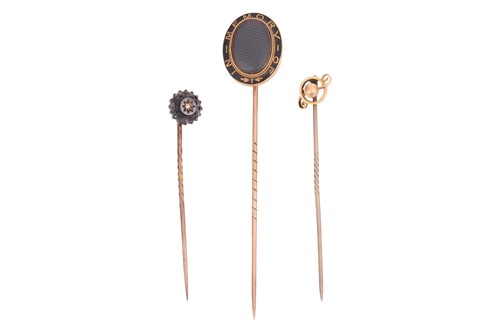 Lot 27 - Three stick pins; The first a gem-set stick...
