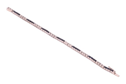 Lot 52 - A sapphire & diamond line bracelet, comprising...