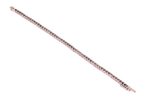 Lot 52 - A sapphire & diamond line bracelet, comprising...