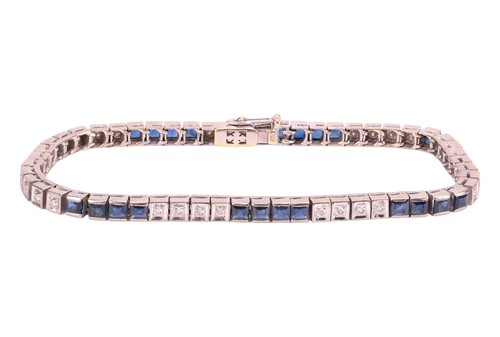 Lot 52 - A sapphire & diamond line bracelet, comprising...