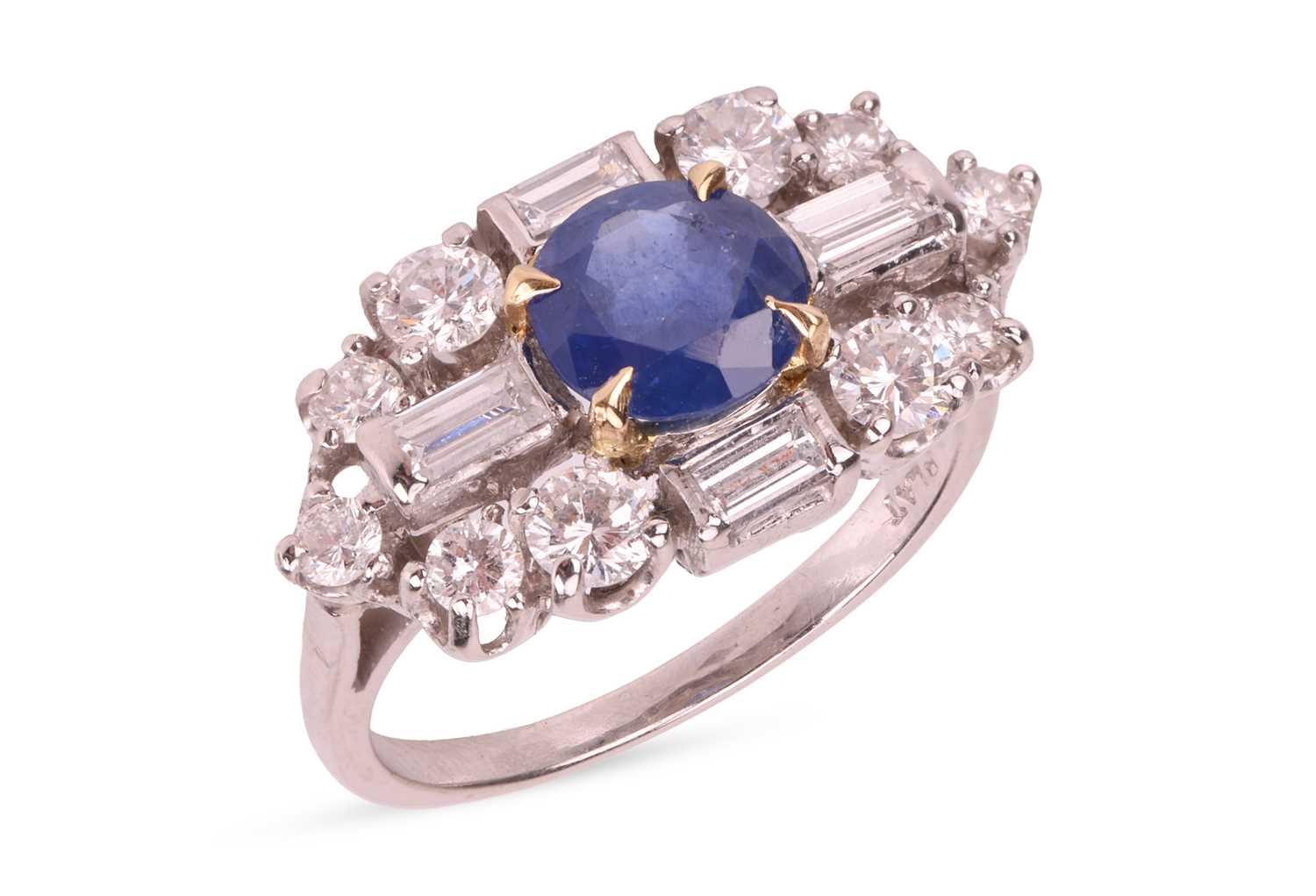 Lot A sapphire and diamond cluster ring,...