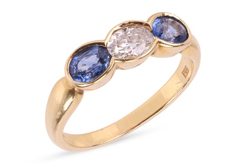 Lot 144 - A sapphire and diamond ring, featuring a...