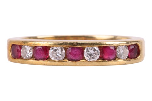Lot 115 - A ruby and diamond half eternity ring,...