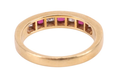 Lot 115 - A ruby and diamond half eternity ring,...