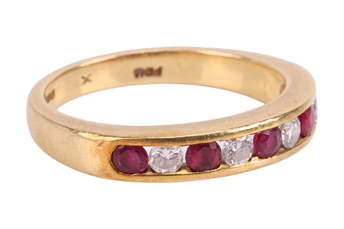 Lot 115 - A ruby and diamond half eternity ring,...