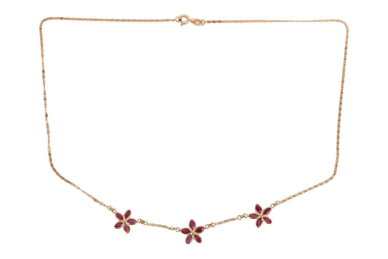 Lot 116 - A ruby necklace of folaite design, featuring...