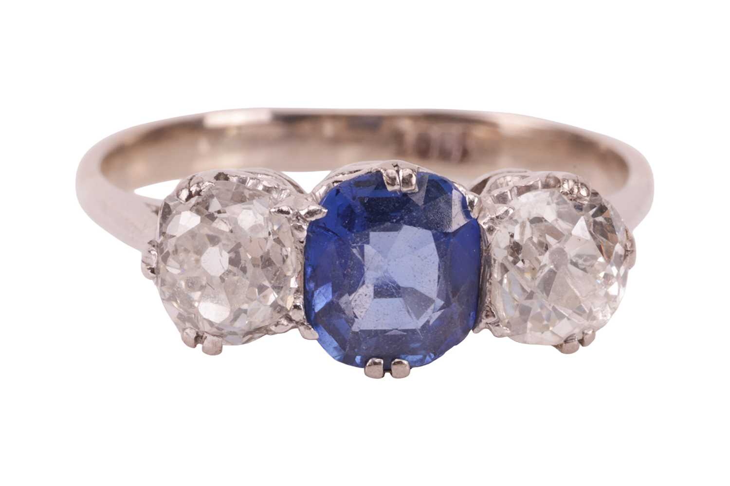 Lot 47 - A sapphire and diamond trilogy ring,...