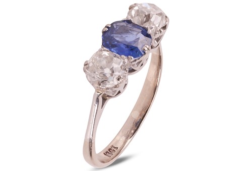 Lot 47 - A sapphire and diamond trilogy ring,...