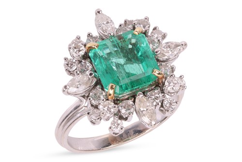 Lot 103 - An emerald & diamond cluster ring, the ring...