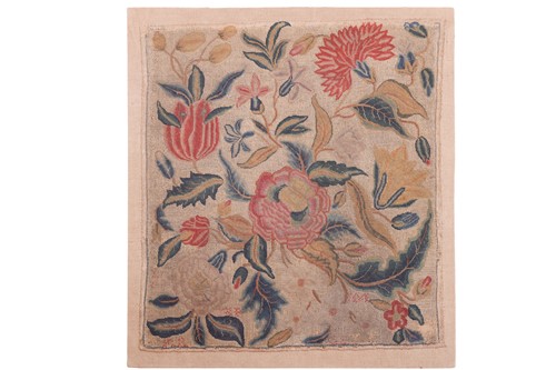 Lot 103 - A 17th-century English crewelwork floral panel,...
